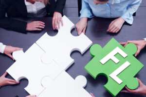 der Vorstand von FL sitzt am Tisch